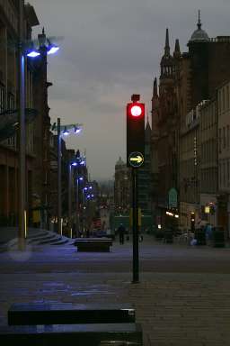 Picture of a street in the evening light, slightly wet after a rain shower