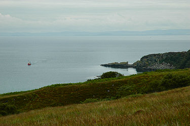 Picture of a view over the sea with a fishing boat