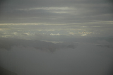 Picture of clouds breaking up and a loch coming into view