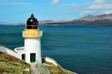 Picture of a lighthouse towering above a sound