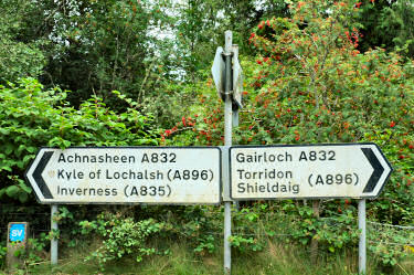 Picture of two road signs pointing in opposite directions