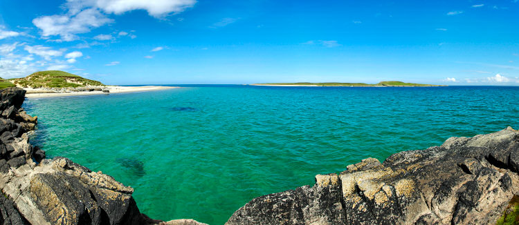Picture of a narrow sound between a coastal point and a small island